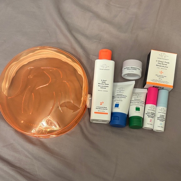 Drunk Elephant Skincare Collection with Orange Bag